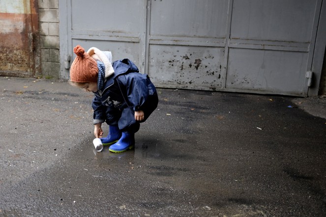 toddler child playing in puddle Bata rubber boots