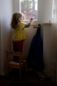 Child Drawing with Washable Window Crayons